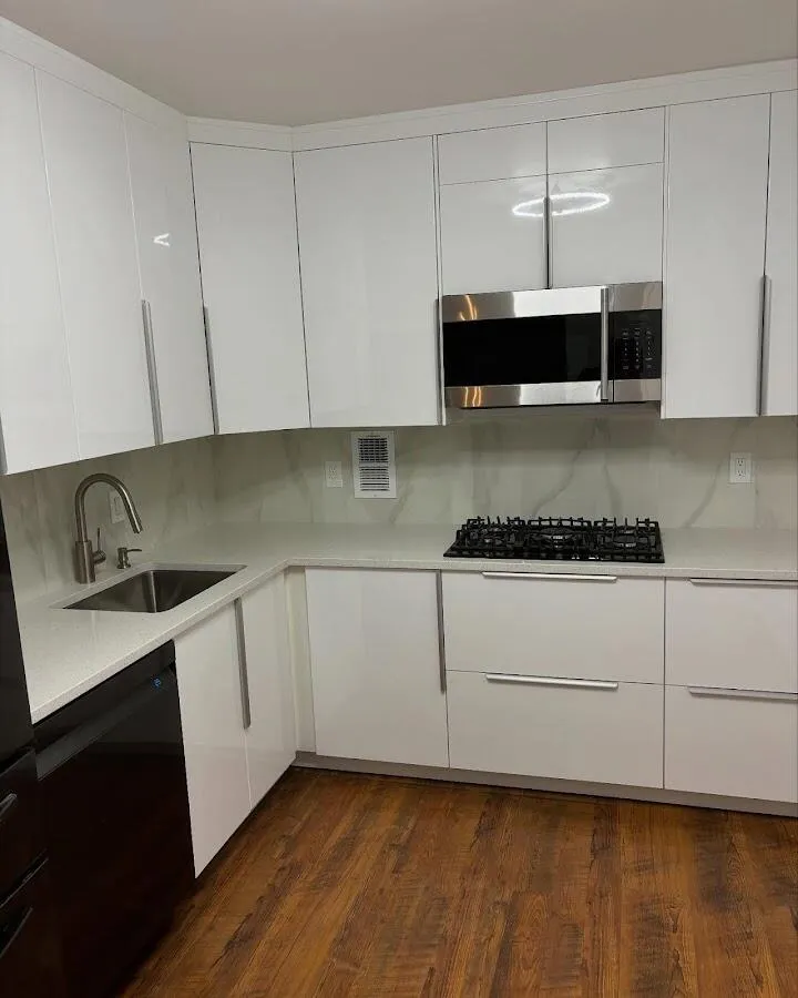 Restored kitchen with white cabinets after water damage in Cliffside Park